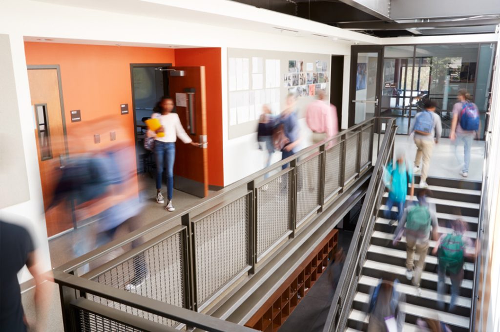 Students walking in school hallway