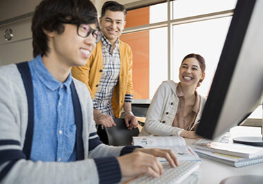 High school students and teacher in computer lab